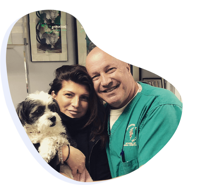 Woman with dog at veterinarian clinic